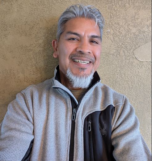Rob De Leon, owner of ComXL Web Design & SEO, smiling